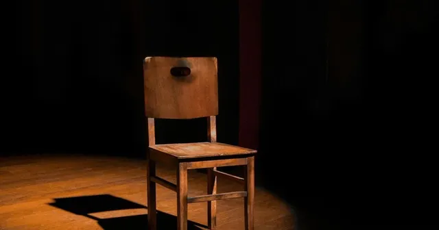 Empty executive chair representing the absent CISO role that CTOs must fill, from IOmergent startup security leadership.