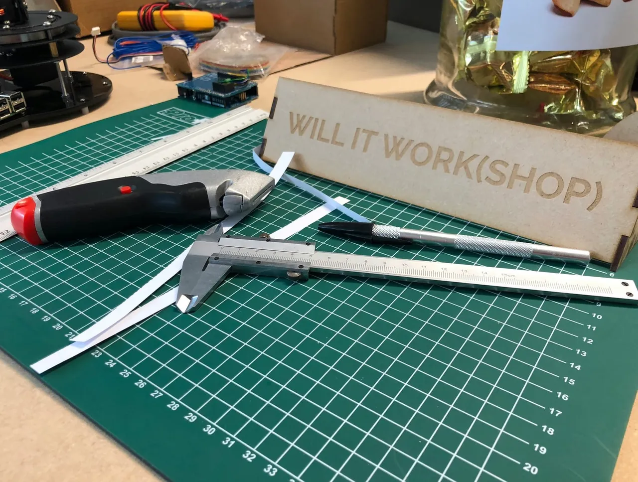 Workshop with precision tools representing custom security tooling that extends cloud scanners, from IOmergent managed CSPM.