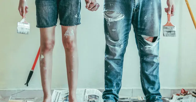 Two people doing DIY home painting with brushes representing the build-it-yourself approach to CSPM versus IOmergent managed services.